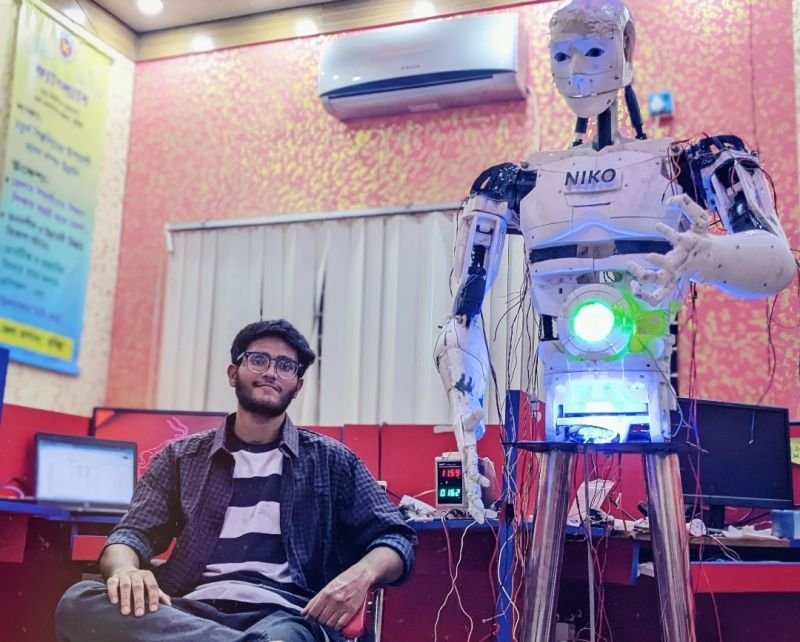 Sitting beside the completed NiKO humanoid robot